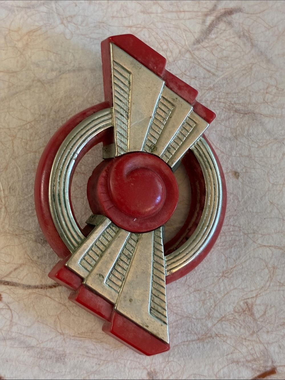 Machine Age Art Deco red Bakelite brooch with chrome overlay